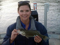 Jessica catching fish on Lake Austin