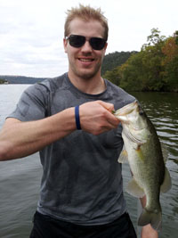 William catching fish on Lake Austin