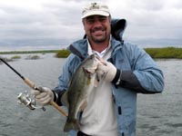 Alex with a nice Lake Falcon bass - his first bass ever